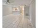 Spacious living room featuring tile flooring and neutral wall paint at 4801 W Mcelroy Ave # D104, Tampa, FL 33611