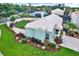 Lovely home featuring fenced yard, beautiful landscaping, charming architecture, and a well-maintained roof at 500 Westborough Ln, Safety Harbor, FL 34695
