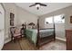 Comfortable bedroom featuring a four-poster bed, classic decor, and ample natural light at 500 Westborough Ln, Safety Harbor, FL 34695