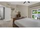 Serene main bedroom with access to an outdoor patio and an en-suite bathroom at 500 Westborough Ln, Safety Harbor, FL 34695