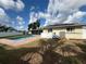 Backyard featuring a pool, patio, grassy area and a fence at 5201 Denver Ne St, St Petersburg, FL 33703