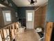 Bathroom undergoing renovations with existing fixtures, a door to outside, and tiled floor at 5201 Denver Ne St, St Petersburg, FL 33703