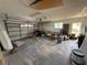 Spacious two car garage with door and window needing to be cleared of items at 5201 Denver Ne St, St Petersburg, FL 33703