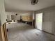 Spacious living room needing renovation, features original built-ins, ceiling fan, and large sliding glass doors at 5201 Denver Ne St, St Petersburg, FL 33703