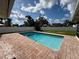 Beautiful swimming pool with brick surround, ideal for summer fun and relaxation in a private backyard at 5201 Denver Ne St, St Petersburg, FL 33703