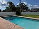 Inviting pool with brick coping, perfect for cooling off and enjoying outdoor living in a private backyard at 5201 Denver Ne St, St Petersburg, FL 33703