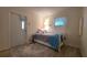 Bedroom with single bed, simple decor, and cozy rug at 5318 Mary St, Zephyrhills, FL 33542