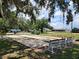 Outdoor bocce ball court featuring multiple lanes, benches, and a scenic community setting at 5318 Mary St, Zephyrhills, FL 33542