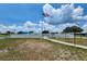 Entrance to community center featuring a white fence and American flag at 5318 Mary St, Zephyrhills, FL 33542