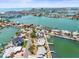 Stunning aerial view of a waterfront neighborhood showcasing canals, luxury homes, and expansive coastal scenery at 5409 Pali Way, St Pete Beach, FL 33706