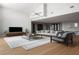 Bright living room with vaulted ceilings, light hardwood floors, and contemporary furnishings at 5409 Pali Way, St Pete Beach, FL 33706