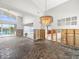 Spacious living room in need of remodeling, offering incredible waterfront views and abundant natural light at 5409 Pali Way, St Pete Beach, FL 33706