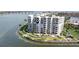 Stunning aerial view of a waterfront condo building with balconies, lush landscaping, and easy access to the bay at 6105 Bahia Del Mar Cir # 683, St Petersburg, FL 33715