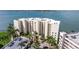Aerial view of the modern high-rise condo building, showcasing its prime waterfront location and ample parking at 6105 Bahia Del Mar Cir # 683, St Petersburg, FL 33715