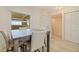 Dining room with seating by the window and closet for storage in a neutral color scheme at 6105 Bahia Del Mar Cir # 683, St Petersburg, FL 33715