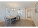 Open-concept dining room with views into the kitchen, and hallway at 6105 Bahia Del Mar Cir # 683, St Petersburg, FL 33715