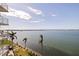 Exterior view of modern condos features a beautiful lawn and scenic water views of the intercoastal waterway at 6105 Bahia Del Mar Cir # 683, St Petersburg, FL 33715