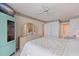 Bright main bedroom with carpet, dresser, and ensuite bathroom access at 6105 Bahia Del Mar Cir # 683, St Petersburg, FL 33715