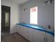 White bathroom vanity with double sinks and lots of storage underneath at 648 Allora Ave, Nokomis, FL 34275