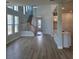 Bright and open living room with hardwood floors and staircase at 648 Allora Ave, Nokomis, FL 34275