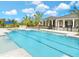 Resort-style pool with lounge chairs and tropical landscaping, perfect for relaxation and recreation at 648 Allora Ave, Nokomis, FL 34275