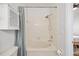 Bright bathroom with tub and shower and storage at 6541 Black Mangrove Dr, Largo, FL 33773