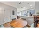 Dining area with a wooden table, four chairs, stainless steel appliances, and a bar height counter overlooking kitchen at 6541 Black Mangrove Dr, Largo, FL 33773