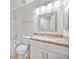 Well-maintained bathroom with a vanity, granite countertop, decorative mirror, and a shower-tub combination, providing a functional space at 659 Kensington Lake Cir, Brandon, FL 33511