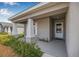 Welcoming front entrance with a covered porch and decorative plants creating curb appeal at 6937 Gideon Cir, Zephyrhills, FL 33541
