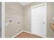 Laundry room with wood-look flooring, shelving, and hookups at 6937 Gideon Cir, Zephyrhills, FL 33541