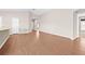 Bright and airy living room with hardwood floors and an open layout, perfect for entertaining at 6937 Gideon Cir, Zephyrhills, FL 33541
