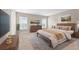 Serene main bedroom with neutral tones, plush carpeting, and bright natural light at 6937 Gideon Cir, Zephyrhills, FL 33541