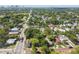 Aerial view of home with mature trees and a detached garage, plus major street access at 702 W Virginia Ave, Tampa, FL 33603