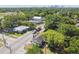 Aerial view of home with mature trees and a detached garage, plus major street access at 702 W Virginia Ave, Tampa, FL 33603