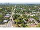 Aerial view of home with mature trees and a detached garage, plus major street access at 702 W Virginia Ave, Tampa, FL 33603