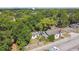 Aerial view of home with mature trees and a detached garage, plus major street access at 702 W Virginia Ave, Tampa, FL 33603