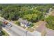 Aerial view of home with mature trees and a detached garage, plus major street access at 702 W Virginia Ave, Tampa, FL 33603