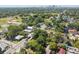 Aerial view of home with mature trees and a detached garage, plus major street access at 702 W Virginia Ave, Tampa, FL 33603