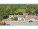 Aerial view of home with mature trees and a detached garage, plus major street access at 702 W Virginia Ave, Tampa, FL 33603