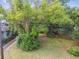 Birds eye view of back yard showing lot lines, neighboring buildings, and large trees at 702 W Virginia Ave, Tampa, FL 33603