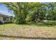 A lot with mature trees and partial fence with potential for building or recreating at 702 W Virginia Ave, Tampa, FL 33603