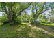 Large mature trees provide lots of shade in the backyard at 702 W Virginia Ave, Tampa, FL 33603