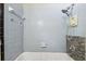 Bathroom with blue tile and new fixtures is ready for your updates at 702 W Virginia Ave, Tampa, FL 33603