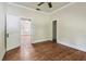 Bedroom features hardwood floors and lots of natural light at 702 W Virginia Ave, Tampa, FL 33603