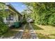 Long driveway that leads to a detached garage at 702 W Virginia Ave, Tampa, FL 33603
