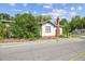 Charming vintage home with a brick chimney and traditional architecture at 702 W Virginia Ave, Tampa, FL 33603