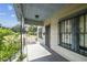 Exterior view of the front porch and facade of the home at 702 W Virginia Ave, Tampa, FL 33603