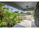 Exterior view of the front porch of the home looking towards the street at 702 W Virginia Ave, Tampa, FL 33603