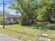 Charming older home with well established landscaping, including mature trees and shrubs at 702 W Virginia Ave, Tampa, FL 33603