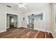 Living room boasts beautiful original hardwood floors, natural light, and craftsman details at 702 W Virginia Ave, Tampa, FL 33603